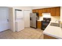 Bright kitchen with stainless steel appliances, white countertops, and tile flooring at 2402 Riverridge Ct, Moncks Corner, SC 29461