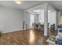 Bright living room and dining area with hardwood floors and decorative pillars at 243 Donatella Dr, Goose Creek, SC 29445