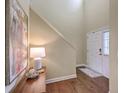 Welcoming foyer featuring hardwood floors, a staircase, and a stylish console table at 255 Longford Dr, Summerville, SC 29483