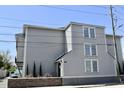 Angle exterior showing a multi-story home with an entrance and a brick fence at 259 E. Bay St # 1A, Charleston, SC 29401