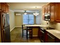 Kitchen with wooden cabinets, granite countertops, and stainless steel appliances at 259 E. Bay St # 1A, Charleston, SC 29401
