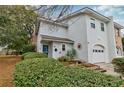 Charming two-story home with a well-manicured lawn and attached garage at 29 Meander Row, Charleston, SC 29412