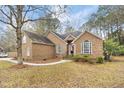 Charming single Gathering home with classic brick exterior, mature trees, meticulous landscaping and sidewalks at 298 Hook Ln, Mount Pleasant, SC 29464