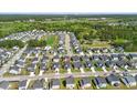 Community aerial view of homes surrounding a picturesque pond and community pool at 306 Todder Trl, Goose Creek, SC 29445