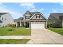 Charming two-story home with a well-maintained lawn and inviting curb appeal at 306 Todder Trl, Goose Creek, SC 29445