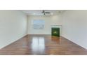 Cozy living room with a fireplace, hardwood floors, and a ceiling fan at 346 Iveson Rd, Summerville, SC 29486