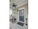 Cozy front porch with seating, decorative details, and a welcoming entrance at 41 Regency Oaks Dr, Summerville, SC 29485