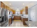 Well-lit kitchen featuring stainless steel appliances, granite countertops and ample cabinet space at 4926 Lake Palmetto Ln, North Charleston, SC 29418