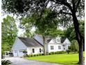 Beautiful home with a spacious driveway, attached garage, and a well-manicured lawn, perfect for suburban living at 5691 Captain Kidd Rd, Hollywood, SC 29449