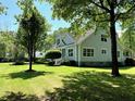 Charming home with a well-maintained lawn and attractive landscaping, creating a peaceful outdoor space at 5691 Captain Kidd Rd, Hollywood, SC 29449