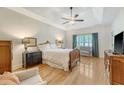 Spacious primary bedroom featuring a tray ceiling, ceiling fan, and neutral paint at 777 Hamlet Cir, Goose Creek, SC 29445