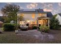 Backyard featuring a deck, patio, a hot tub, and solar panels on the roof at 79 Rivers Point, Charleston, SC 29412