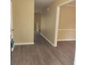 Inviting entryway with neutral walls and modern dark vinyl flooring, creating a warm welcome at 9471 Netted Charm Ct, Ladson, SC 29456