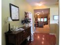 Welcoming foyer with hardwood floors, leading to a spacious living area at 9677 Islesworth Way, Summerville, SC 29485