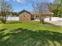 Beautiful brick home with a lush green lawn, a single-car garage, and a cozy front porch at 103 Sycamore Dr, Summerville, SC 29485