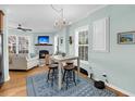 Charming living room with fireplace, hardwood flooring, and natural light at 118 Congress St # F, Charleston, SC 29403