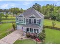 Gorgeous aerial view of a two story home with a well-maintained lawn and a fenced backyard, creating a private oasis at 123 Mcdonald Ct, Summerville, SC 29485