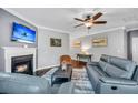 Comfortable living room featuring a fireplace, hardwood floors, and an open layout perfect for relaxation at 123 Mcdonald Ct, Summerville, SC 29485