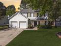 Charming two-story home featuring a two-car garage and well-manicured lawn at 139 Pointer Dr, Goose Creek, SC 29445