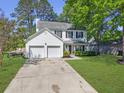 Charming two-story home featuring a two-car garage and well-manicured lawn at 139 Pointer Dr, Goose Creek, SC 29445