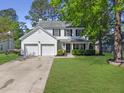 Charming two-story home featuring a two-car garage and well-manicured lawn at 139 Pointer Dr, Goose Creek, SC 29445