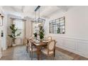 Bright dining room showcasing a stylish chandelier, statement mirror, and a beautifully set wooden table at 152 Seaton St, Summerville, SC 29486