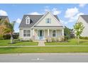 Attractive single-story home with manicured lawn and a bright turquoise front door at 154 Helena Park Dr, Summerville, SC 29486