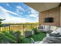 Relaxing balcony with comfortable seating and beautiful views, perfect for enjoying the outdoors at 155 Wingo Way # 433, Mount Pleasant, SC 29464