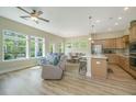 Bright living room features hardwood floors, large windows, and modern furniture at 1623 Adventure Xing # 109, Mount Pleasant, SC 29466