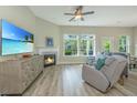 Comfortable living room with a fireplace and large TV offers a relaxing space at 1623 Adventure Xing # 109, Mount Pleasant, SC 29466