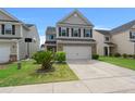 Charming two-story home featuring a two-car garage and well-maintained landscaping at 169 Longford Dr, Summerville, SC 29483