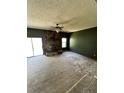 Cozy living room with a stone fireplace and natural light at 1805 Wood Duck Rd, Moncks Corner, SC 29461