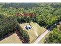 Aerial view of 2.3 acre property featuring a home surrounded by lush trees at 2102 Williams Rd, Ruffin, SC 29475
