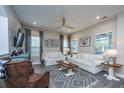Cozy living room with neutral tones, wood floors, comfortable seating, and ample natural light at 249 Oak View Way, Summerville, SC 29483