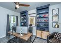 Office with custom built-in shelving, a wood desk, and plenty of natural light, perfect for remote work at 249 Oak View Way, Summerville, SC 29483