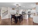 Open dining area features a ceiling fan and flows into the kitchen, perfect for gatherings at 2840 Conservancy Ln, Charleston, SC 29414