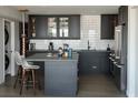 Modern kitchen with sleek black cabinetry, stainless steel appliances, and white subway tile backsplash at 330 Concord St # 14D, Charleston, SC 29401