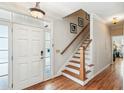 Inviting foyer with hardwood floors, white wainscoting, and a staircase leading to the upper level at 339 Clayton Dr, Charleston, SC 29414