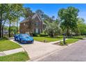 Spacious home on a tree lined street with a long driveway and beautiful curb appeal at 4407 Wild Thicket Ln, North Charleston, SC 29420