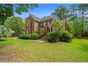 Two-story brick home with a well-maintained lawn and inviting front steps at 4407 Wild Thicket Ln, North Charleston, SC 29420