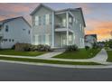 Charming two-story home boasting a beautiful sunset and manicured lawn at 500 W Respite Ln, Summerville, SC 29483
