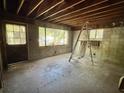 The interior shows exposed wood beams and block walls; the space is ready for renovation and design at 5901 Sedgefield Dr, Hanahan, SC 29410