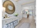 Elegant entryway with hardwood floors, a stylish console table, and a view of the open-concept living area at 606 Dunswell Dr, Summerville, SC 29486