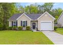Charming single-Gathering home with a well-maintained lawn and an attached one car garage at 102 Vango Dr, Goose Creek, SC 29445