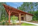 Exterior view of a well-maintained outdoor structure with stone accents and a concrete pathway at 139 Seaton St, Summerville, SC 29486