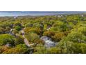 Beautiful aerial shot of the home nestled amongst trees, showcasing its proximity to the water at 1409 Lieben Rd, Mount Pleasant, SC 29466