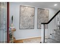 Elegant entryway featuring staircase, hardwood floors, and tasteful art decor at 1603 Ventura Pl, Mount Pleasant, SC 29464