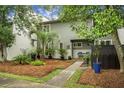Charming two-story home features a well-maintained landscaped yard with a pathway to the front door at 1603 Ventura Pl, Mount Pleasant, SC 29464