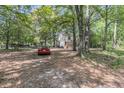 Scenic driveway leads to a charming home nestled among mature trees, offering privacy and a tranquil setting at 1628 Point Park Dr, Johns Island, SC 29455