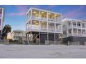 Three-story beach house with multiple decks offering stunning ocean views and beach access at 1681 E Ashley Ave # B, Folly Beach, SC 29439